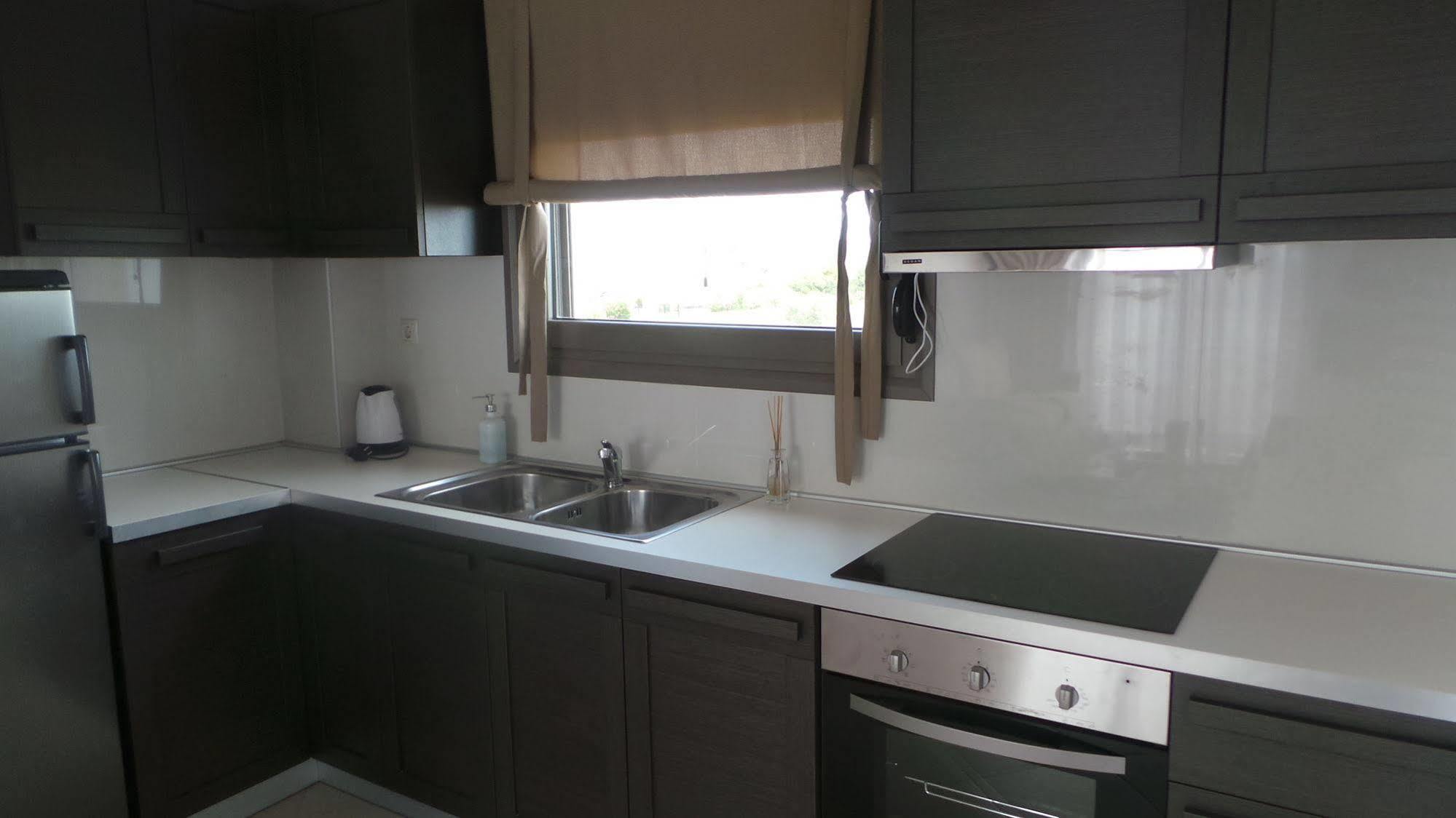 Niovi Boutique Apartments Афитос Экстерьер фото